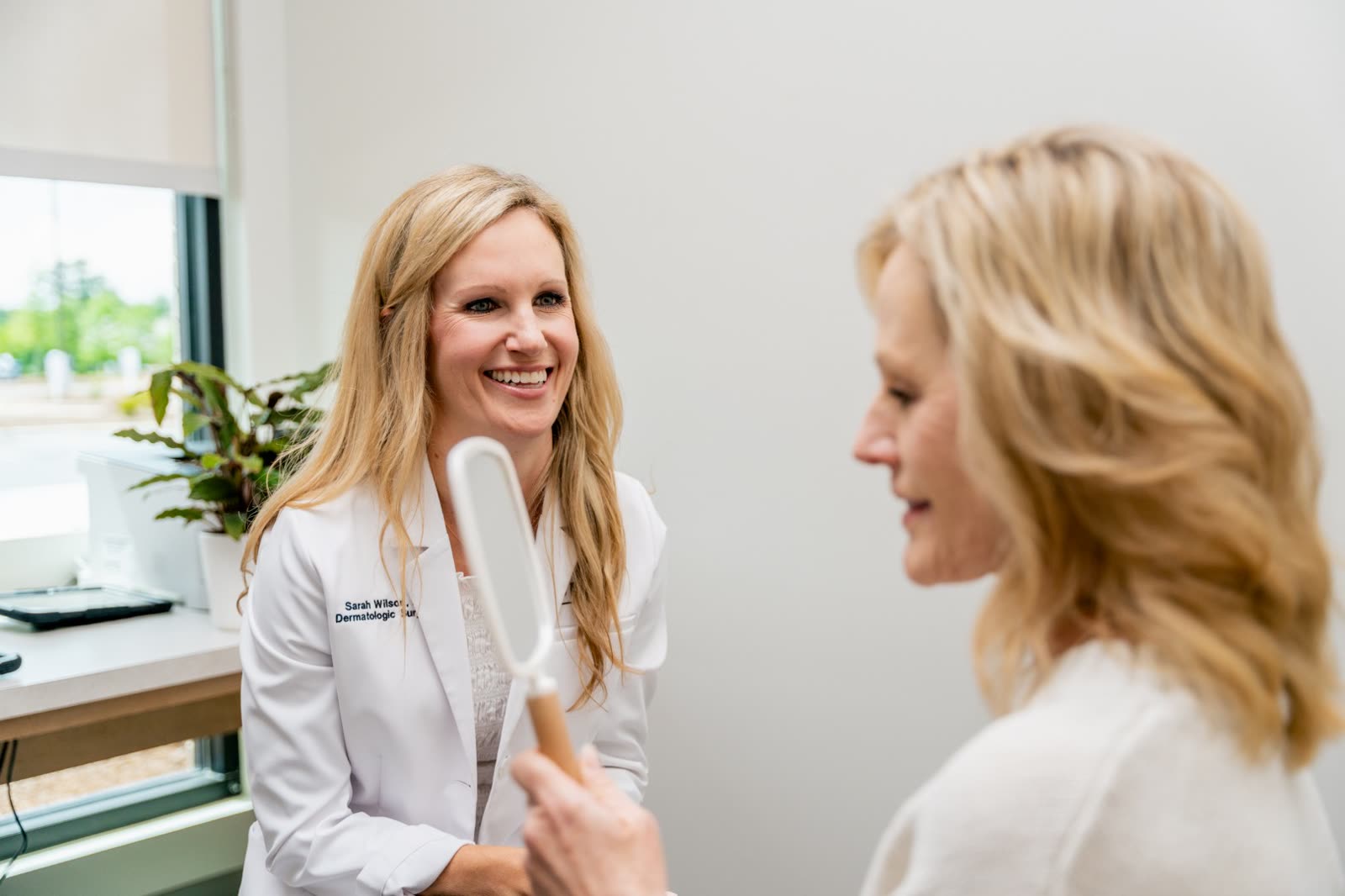 Dr. Sarah Wilson in a cosmetic consultation at Carroll Cosmetic Club