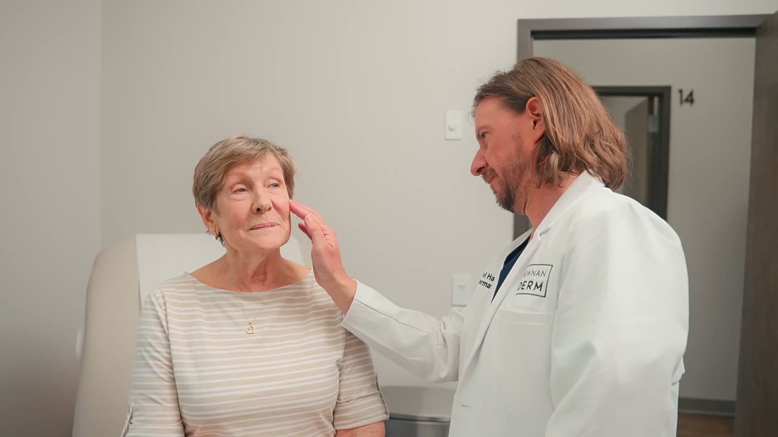 Dr. Paul Haun with a patient at Peachtree City Dermatology